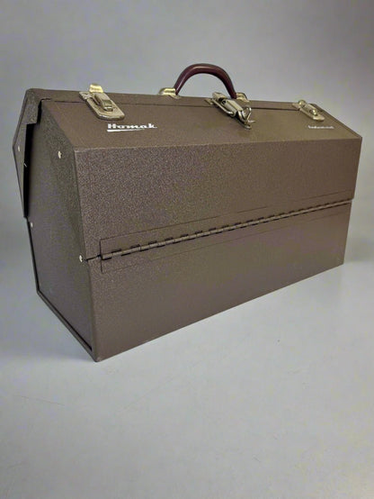 Brown Homak toolbox with a handle on a gray background homak 22 inch heavy duty cantilever toolbox